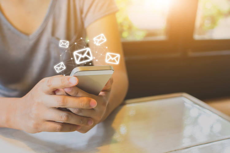 Asian woman hand using mobile phone with e-mail application, Concept email and newsletter